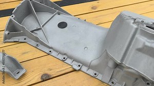 Witness the sandblasting treatment on automotive parts showcasing the preparation for a smooth surface finish. This process is essential before applying coatings.