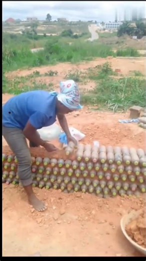 This woman Is Building a House with Plastic Bottles