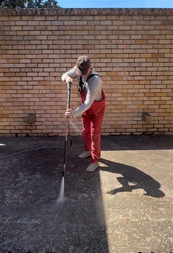 Pressure Washing Abandoned Courtyard