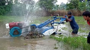 5.8K views · 86 reactions | In this video, I have shared that the power tiller operator is cleaning the power tiller in waterlogged land. The power tiller is lifted to the higher ground after cleaning. | Power Tiller BD & Machinery Tools | Facebook