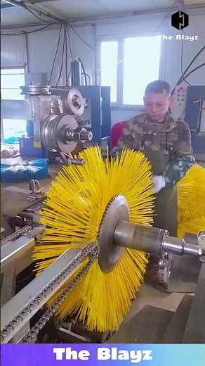Long plastic hooks being attached to steel using machine