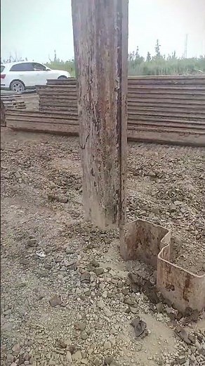Heavy Sheet Pile Driver Pushing Metal Steel Into Dirt