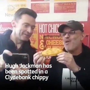 Hollywood star Hugh Jackman has been spotted in a Clydebank chippy, sampling Scotland's 'greatest' delicacy - the pizza crunch. https://bit.ly/2JrGs6f | STV News