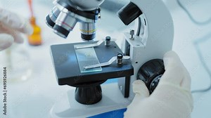 Scientists using microscope in Bio lab and experiment, Concept science and technology