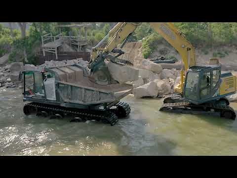 PRINOTH PANTHER T14R rotating tracked dumper with heavy load on the shores of Lake Michigan
