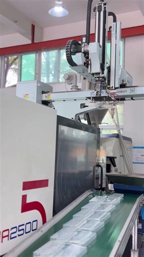 Take a look at this automatic injection molding machine in action!