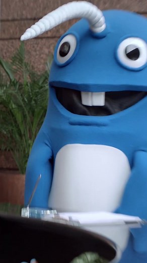 Humorous Narwhal Mascot Receptionist Encounter