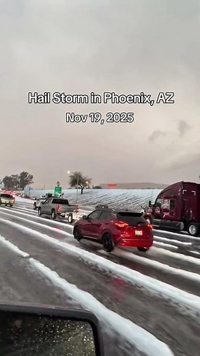 A hail storm is covering the road around the I-10 and 75th Ave in Phoenix, AZ, making it look