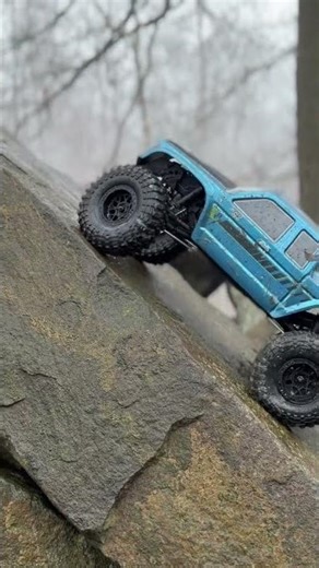 Axial SCX10 Coyote climbing on wet rock