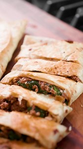 Allow us to introduce you to one of our favorite weeknight meals: Beef, Spinach and Feta Gozleme. Typically made with a Turkish stuffed flatbread, we adapted a weeknight version using flour tortillas, toasting them in the same skillet we use to cook the savory, meaty filling. #MilkStreetTV cast member and #FriendofMilkStreet Sam Fore shows you how to make it. Get the recipe: https://bit.ly/3fTekrr | Christopher Kimball’s Milk Street