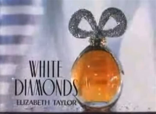 OUT TO LUNCH on Instagram: "#BTS - “White Diamonds” *Elizabeth Taylor’s White Diamonds perfume commercial *c.1991 Elizabeth Taylor White Diamonds is a classic fragrance that embodies elegance and sophistication. Launched in 1991, this perfume reflects Taylor's glamorous persona and her love for the finer things in life. The scent features a captivating blend of jasmine, lily, and rose, intertwined with warm notes of amber and sandalwood. This combination creates a rich and luxurious fragrance th