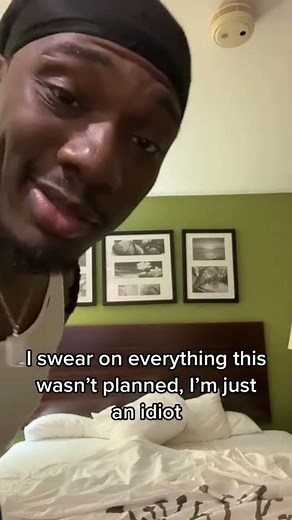 Excited Man Jumps on Hotel Bed and hits his Head against the Ceiling