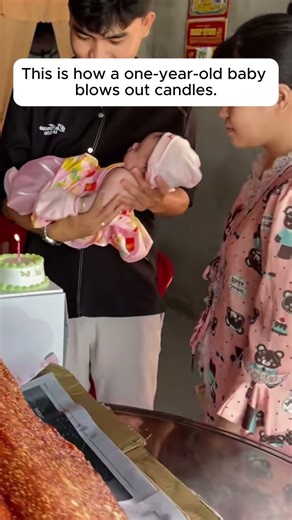 This is how a one-year-old baby blows out candles.