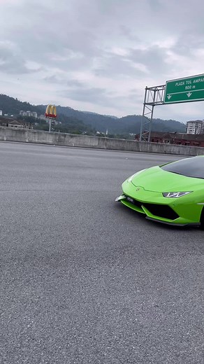 Sleek Green Lamborghini Sports Car on Highway