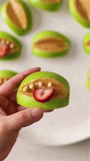 It's Halloween tomorrow, get the kids in the kitchen for some spooky fun! Recipe 👇 Ingredients: - 3 Granny Smith apples (or apple of choice), quartered and core removed - ¼-½ cup smooth peanut butter, or choice of nut or seed butter - ¼ cup strawberries, sliced - Pine nuts, slivered almonds, sunflower seeds or pumpkin seeds - 4 mango cheeks, cut into a criss cross pattern - 2 bananas, halved - ½ cup blueberries - Edible candy eyeballs, as needed Method: 1. Cut a wedge out of each apple quarter 