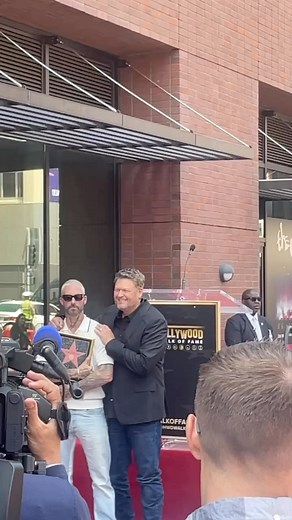 Adam Levine receives a kiss from Blake Shelton at the country star’s Hollywood Walk of Fame ceremony earlier today. 💋 Tap our bio link to read more about Shelton’s ceremony! | People