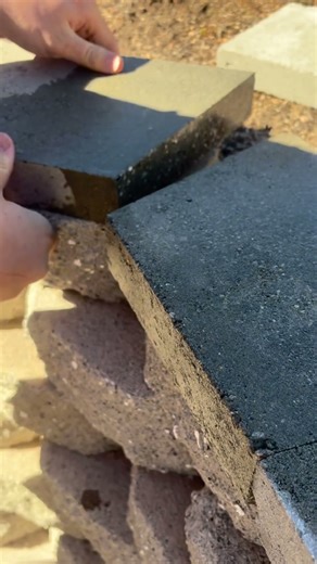 Install caps (retaining wall)