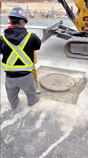 Construction: Compacting Gravel Around a Manhole with a Gas Plate Compactor