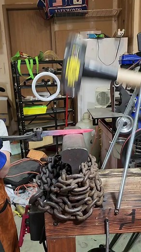 My son using the diy power hammer on a spike knife