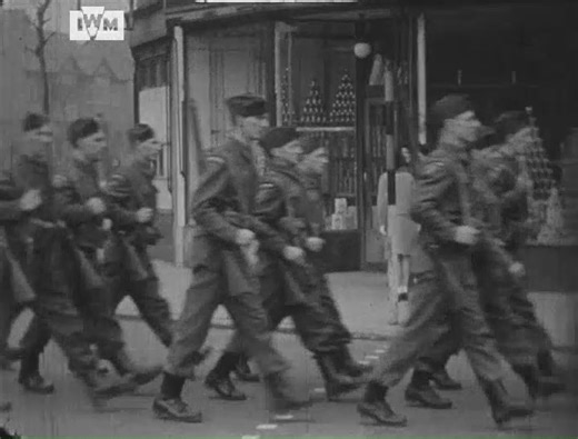 Members of the Coventry branch of the Warwickshire Home Guard parade through the streets in this amateur film shot by Lieutenant Leonard Stanley North, a rifle instructor associated with the Royal Warwickshire Regiment, 1942. Film: IWM MGH 6900 | Imperial War Museum London