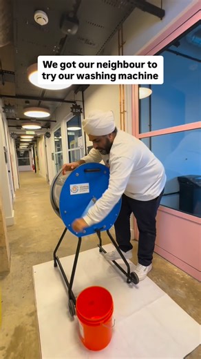Moments like this at our new office! We were recording a video demo when our neighbour stopped to see the machine for the first time. He called it a good arm workout, which we often find lot of people say when they spin the machine for 5-6 minutes across a 30 minute wash cycle 🧺🙌🏽 #laundry #washingmachine #innovation #sustainability #awareness | The Washing Machine Project