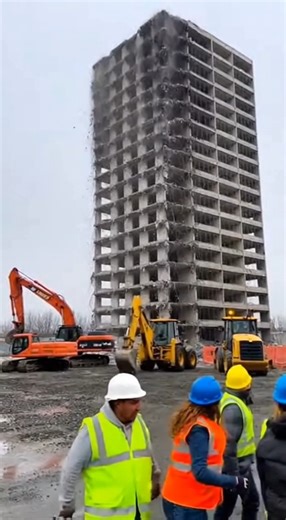 January 7, 2026 — South Los Angeles, California The countdown hit zero. Charges popped — sharp, fast — but the building didn’t fall the way it was supposed to. Instead of dropping inward, the structure twisted. One side hesitated. The other gave. Concrete spilled sideways. Dust exploded into the street as debris slammed into adjacent buildings, crushing scaffolding and cars below. People ran blind through the cloud, coughing, shouting, trying to find the edges of something that no longer made se