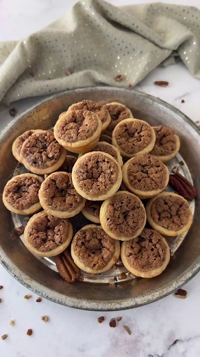 These Pecan Tassies are little mini pecan pie cookies made with a flakey crust and decadent pecan pie filling! Easy to make and great for sharing, they are a perfect little treat! #pecantassies #christmascookies #holidaycookies #christmasdessert #pecanpiecookies #cookies | Life, Love and Sugar