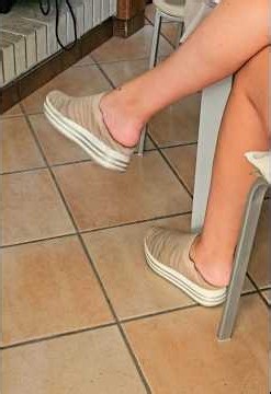 Candid dangling shoeplay feet soles