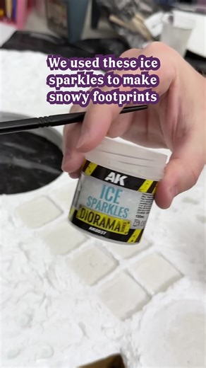 We wanted our snowy winter game board to feel realistic, so we added icy footprints right into the terrain using polymer clay foot stamps. ❄️ Using @AK Interactive Ice Sparkles, we layered packed snow into each footprint for that crisp, icy texture you see in real tracks. Huge thanks to AK Interactive for sending these over 💙 Full process video is up on YouTube → Couple Crafts Minis #Miniature #crafting #winterscene #diorama #AKInteractive