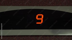Digital scoreboard showing floor number. Digital Display in the Elevator with Arrow down Shows Floors from 11 to 6. Lift going down. Cabin of modern passenger elevator.