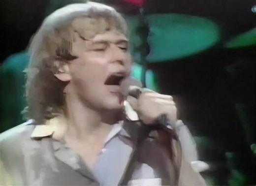 You're Driving Me Out Of My Mind is a Dance Rock/Pop Rock song originally recorded by the Australian band Little River Band (LRB). This track was released during the period when John Farnham served as the band's lead vocalist (1982–1986), replacing Glenn Shorrock. The version you requested was recorded live during a special TV concert in Melbourne, Australia in 1983. It was part of the promotion for their album The Net, marking LRB's shift towards a more robust contemporary Pop/Rock sound under 