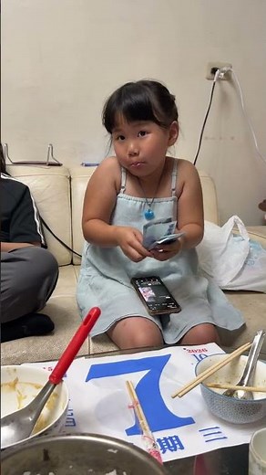 #familyvlog Girl Sitting on Sofa Counts Thousand NTD Bills while Adult Takes Back Red Envelop.