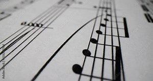 White paper with musical notes closeup. Learning to read music