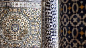 Moroccan zellige mosaic pattern in traditional Islamic geometric design in Morocco. Made with natural colors from indigo, saffron, mint, kohl. 4k Moroccan design background footage changing focus.