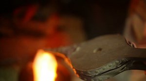 Using bellows on a fire