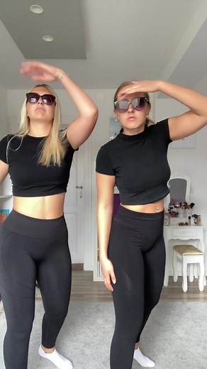 Synchronized Dance Routine by Two Women in Modern Setting