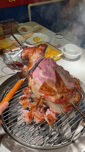 Carving a Perfectly Roasted Rotisserie Leg of Lamb Right at the Table​