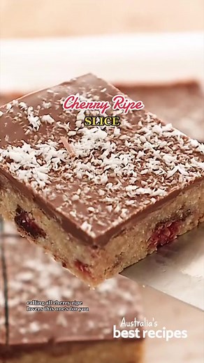 Cherry Ripe Slice | Full Recipe: https://www.bestrecipes.com.au/recipes/easy-cherry-ripe-slice-recipe/i50kymgu #bestrecipes #bestrecipesau #bestrecipesaustralia #cherryripe #cherryripeslice #chocolate #slice #dessert #recipe #sweets #nobake #baking #nobaketreats | Best Recipes