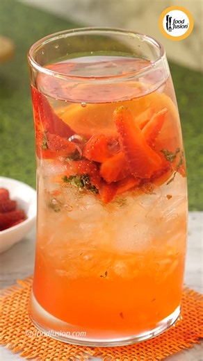Refreshing new fresh strawberry lemonade recipe for you to try at home. #HappyCookingToYou #FoodFusion #Strawberry #lemonade Ingredients: -Lemon sliced 2 large -Strawberries sliced 150g -Mint leaves chopped 2 tbs -Sugar powdered 6 tbs or to taste -Ice crushed -Chilled water 1 Cup Directions: -In a jug,add lime slices,strawberries,mint leaves,sugar powdered & mix well,cover & let it rest for 2-4 hours & stir in between. -In a serving glass,add crushed ice,prepared strawberry & lemon mixture (3-4 