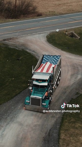 Tri-Axle Dump Truck Reversing with American Flag - Armbruster Motor Company
