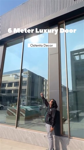 Ostenta Decor on Instagram: "6 meter heavy door by Ostenta Decor We customize premium doors and windows to complement your home’s architecture, delivering quality across India. 📍 Ostenta Decor 89, Jay Jalaram Ind. Soc., Near Navjivan Circle, Udhna–Magdalla Road, Surat, Gujarat ✨ Give your home a refined upgrade. 📩 DM us to get started 📞 Call: +91 7016502324 #OstentaDecor #LuxuryDoors #AluminiumDoors #AluminiumWindows #SlimProfile #ModernInteriors #LuxuryInteriors #ArchitecturalDesign #Interio