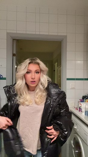 Stylish Black Puffer Jacket in Modern Bathroom