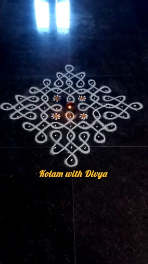 Divya on Instagram: "Traditional elegant sikku kolam for karthigai deepam special#reelsrangoli#kolam#muggulu#karthigaideepamspecial"