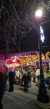 Massive Santa and Reindeer Float Gliding Through Night Parade