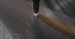 The process of cutting a metal part with a plasma cutter. Plasma cutting. Plasma cutter work at the factory. The plasma cutter will cut the part.