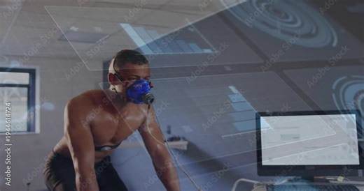Male pedaling on bike as monitor starting exercise test, wearing blue mask, HUD overlaying metrics