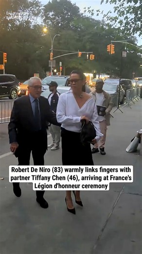 Robert De Niro lovingly holds partner Tiffany Chen's hand, arriving at the Légion d'honneur event