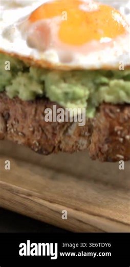 Super slow motion, Closeup Yolk Wobble Slow Motion Macro Frame Of Glossy Egg Yolk And Creamy Smashed Avocado Stock Video Footage - Alamy