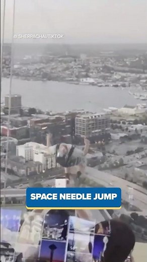 BASE jumpers parachute off Space Needle observation deck