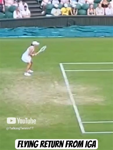 Iga Swiatek flies through the air as she hits a return of serve against Petra Martic #wta #wimbledon #tennis #wtatour